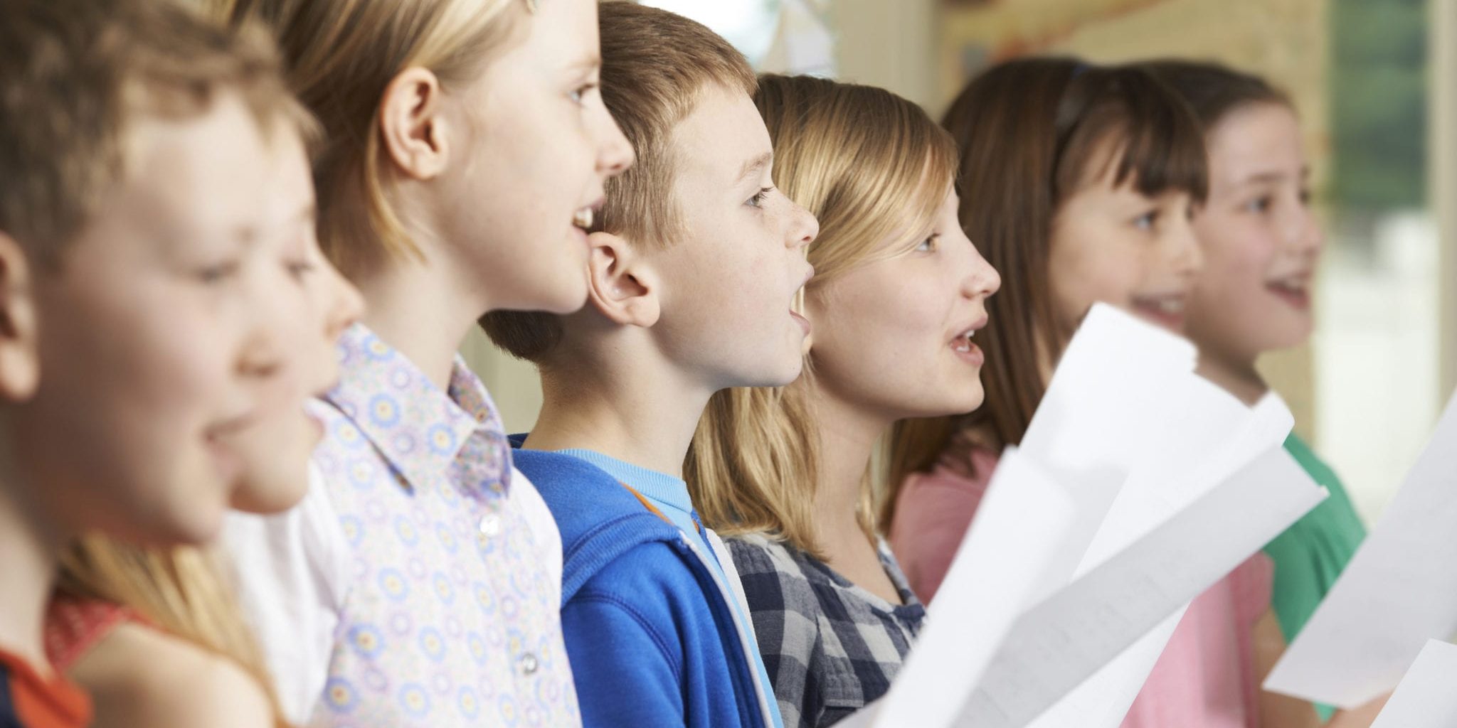 Group Of School Children Singing In School Choir
** Note: Shallow depth of field