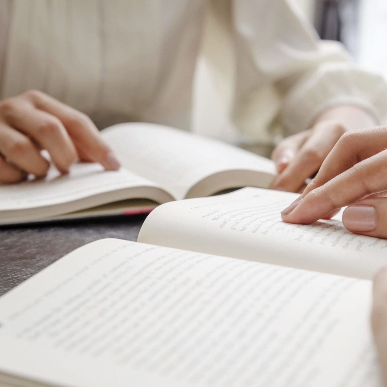 Close up of human hand reading bible